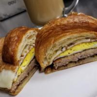 Breakfast Sandwich Combo · Over hard or scrambled egg, sausage, bacon with cheese on a bagel, English muffin or croissa...