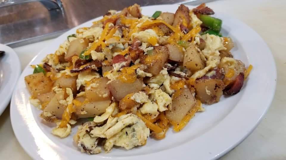 Breakfast Bowl · Scrambled or over hard eggs, cheese, sausage, bacon, potatoes mixed together.