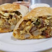 Breakfast Burrito · Scrambled or over hard eggs, cheese, sausage or bacon, potatoes in a white wrap. Served with...