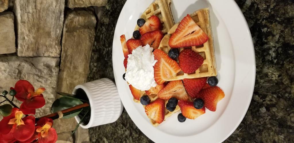 Waffle · Belgian waffle with butter and syrup. Add fruit toppings and whipped cream for an additional charge. Add peanut butter, Nutella and banana for an additional charge.