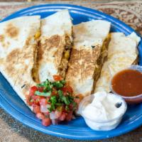 Chicken Quesadilla · Spicy chicken, black beans, corn and cheese. Sour cream on the side.
