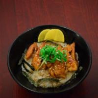 Chicken Teriyaki Don · Chicken thigh marinated in teriyaki sauce served over rice. Served on premium rice with nori...