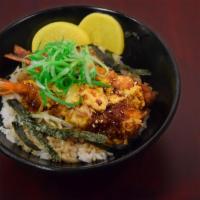 Shrimp Ebi Ju · Panko breaded shrimp cooked in egg. Served on premium rice with nori and takuan.