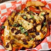 Sweet N Spicy · 4 traditional wings, fries, cheese curds, bacon bits, green onions with honey mustard, and c...