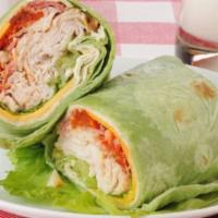 Turkey Sausage, Eggs and Cheese Wrap  · Sizzling slices of turkey sausage with cooked eggs and melted cheese topped on customer's ch...