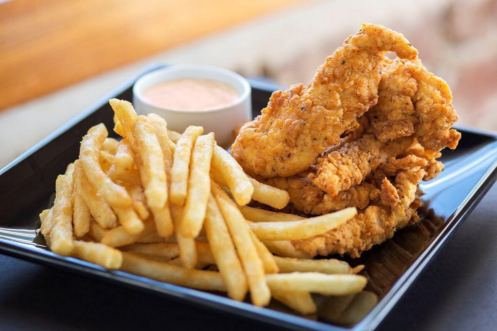 Chicken Tenders · Buttermilk marinated, hand breaded, and perfectly fried. Served with fries and your choice of dipping sauce.