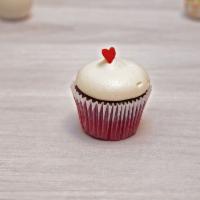 Mini Red Velvet Cupcake · A mini red velvet cupcake topped with cream cheese frosting.