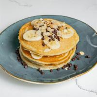 Chocolate Chip Pancake · Sliced banana and almonds, drizzled with maple syrup.