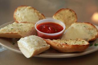 Garlic Bread Appetizer · Served with a side of homemade marinara sauce.