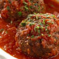 2 Meatballs · Homemade meatballs topped with marinara sauce.