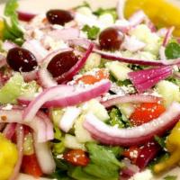 Greek Salad · Roma tomato, cucumber, red onion, pepperoncini, Kalamata olives, and feta cheese.