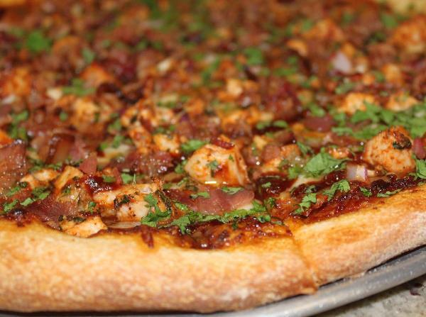 BBQ Bacon and Chicken Pizza · BBQ sauce, bacon, chicken, red onions, and cilantro.
