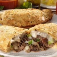 Philly Steak Calzone · Mushrooms, green peppers, onions, mozzarella, and juicy steak inside a calzone with a side o...