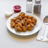 Breaded Mushrooms · Our own hand breaded mushroom deep fried to a crispy golden brown and served with your choic...