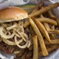 Pulled Pork Sandwich · Shredded pork topped with onion strings and BBQ. Served with hand cut fries.