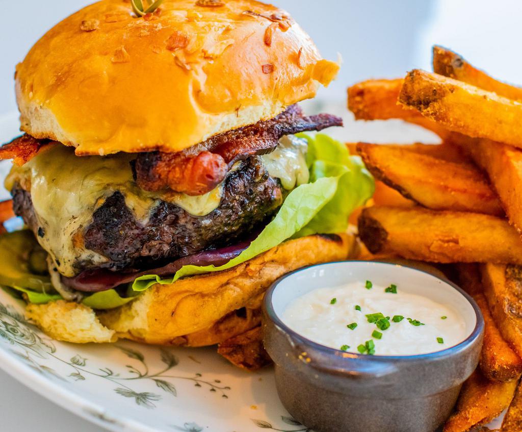 House Ground Prime Dry Aged Burger · coal fired onions, bacon, house pickles, cheddar, smoked horseradish-russian dressing, onion brioche roll, thick cut fries