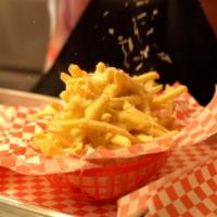 Garlic Parmesan Truffle Fries · Fries tossed with garlic butter and truffle oil, topped with shaved parmesan.