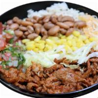 Mexican Chorizo Burrito Bowl · Mexican chorizo burrito bowl topped with lime rice, choice of beans, pico de gallo, corn, ch...