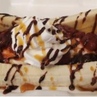 Banana Split Sundae · 2 scoop vanilla ice cream with hot fudge , strawberries, whip cream, Hershey's chocolate syr...