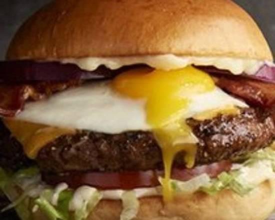The Hangover Burger · Fried egg · bacon · American cheese · lettuce · tomato · red onions · mayo · french fries.