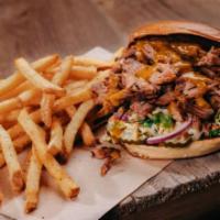 Pulled Pork Sandwich · Smoked pulled pork, creamy coleslaw, pickles and BBQ sauce, onion ring, french fries.