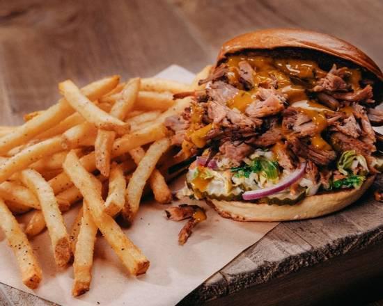 Pulled Pork Sandwich · Smoked pulled pork, creamy coleslaw, pickles and BBQ sauce, onion ring, french fries.