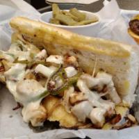 Grilled Chicken Philly Sandwich · Grilled chicken breast served with sauteed onions, topped with cheese and mayonnaise on a ho...