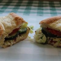 Vegetarian Sandwich · Dill cream cheese, shredded lettuce, cucumbers, marinated tomatoes, onions, and green pepper...