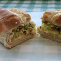 Turkey Avocado Sandwich · Oven-roasted turkey with melted provolone cheese, avocado spread, mayonnaise, lettuce and to...
