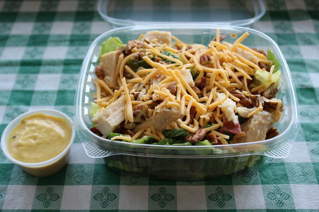 Chicken Pecan Salad · Tomatoes, cheddar cheese, grilled chicken, capicola and chopped pecans with honey mustard dressing. Served on fresh, crisp romaine lettuce.