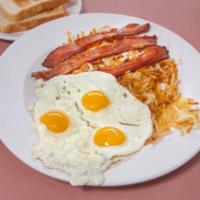 2 Eggs Any Style with Bacon Breakfast · Served with hash browns and your choice of toast, buttermilk pancakes or biscuits and gravy.