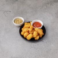 Cheese Curds · Fried Wisconsin cheddar curds with house marinara.