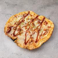 BBQ Chicken Pizza · BBQ sauce base, chicken, onion, cheddar cheese, and BBQ sauce drizzled on top.