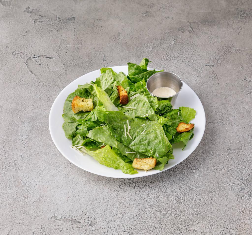 Caesar Salad · Romaine lettuce and garlic crouton with shaved Parmesan cheese and  Caesar dressing.