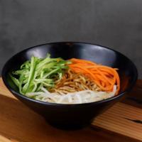 Zha Jiang Mian · Freshly boiled noodles covered with special stir fried sauce, topped with fresh veggie slices.