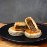 Pan Fried Ground Beef Cake · 3 pieces. Grilled pastries with seasoned ground beef fillings.