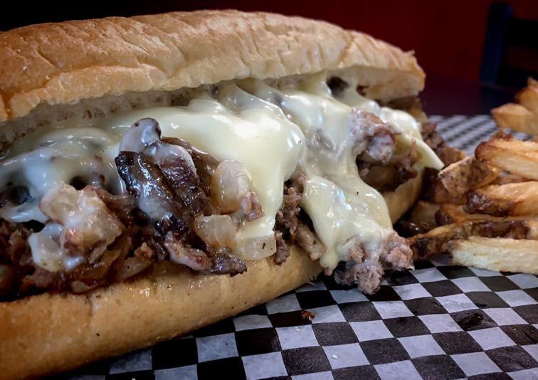 Philly Cheese Steak · Served with grilled mushrooms, grilled onions, 3 swiss cheese on a toasted hoagie.