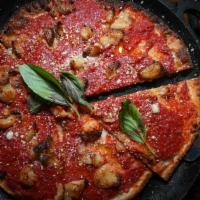 Grandma's Tomato Pizza · Crushed tomatoes, roasted garlic, pecorino cheese, and extra-virgin olive oil.