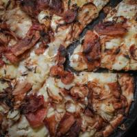 Carbonara Pizza · Bacon, caramelized onions, bechamel, fresh mozzarella, and pecorino cheeses.