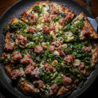Broccoli Rabe and Sausage Pizza · Broccoli rabe, sausage, fresh mozzarella, grated pecorino cheese, and fresh garlic.