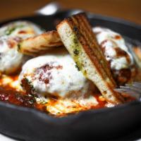 Cast Iron Meatball Parm · Our famous 8 oz. house-made meatball braised for hours served with mozzarella cheese, marina...