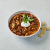 Beef & Black Bean Chili · topped with onions, monterey jack & cheddar cheeses, and sour cream