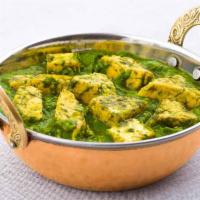 Palak Paneer · Fresh spinach gravy cooked with fresh made cottage cheese flavored with spices.