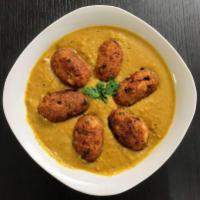 Malai Kofta  · Deep fried potato and cottage cheese balls seasoned with spices and served with  creamy toma...