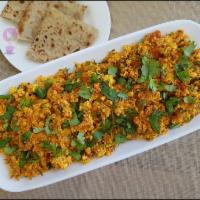 Paneer Bhurji  · Ground cottage cheese cooked with onions and Indian spices.