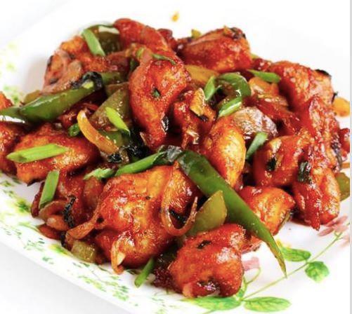 Chilly Chicken · Deep fried batter coated chicken cooked in chili-ginger-garlic paste with spices and tomato sauces.
