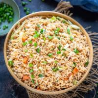 Veg  Fried Rice · Stir fried basmati rice tossed with vegetables garnished with green onions.