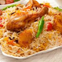 Chicken Biryani · Aromatic basmati rice dum-style cooked with chicken, spices and nuts flavored with saffron.