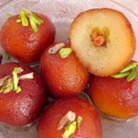 Gulab Jamun · Spongy milky balls soaked in sugar syrup