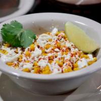 Ezquite · Mexican street corn served with mayonnaise, queso fresco, lime and chile, It's creamy and in...